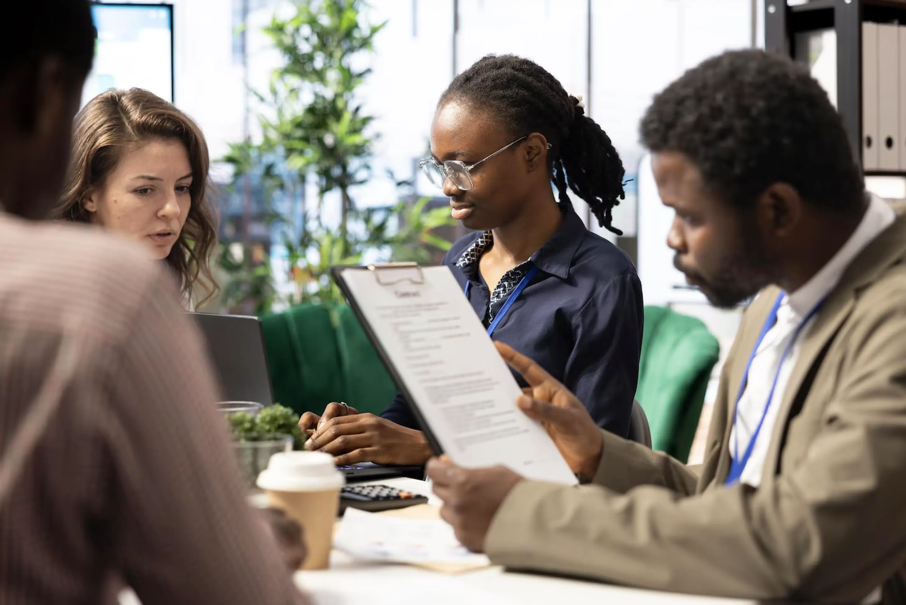 A recruiter and a candidate reviewing a CV together.